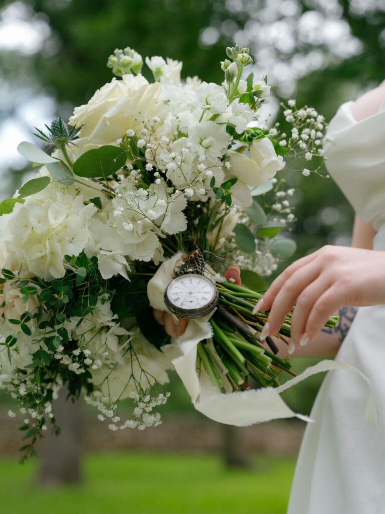 Dana holding her bouquet during solo portraits at an Addison Grove wedding