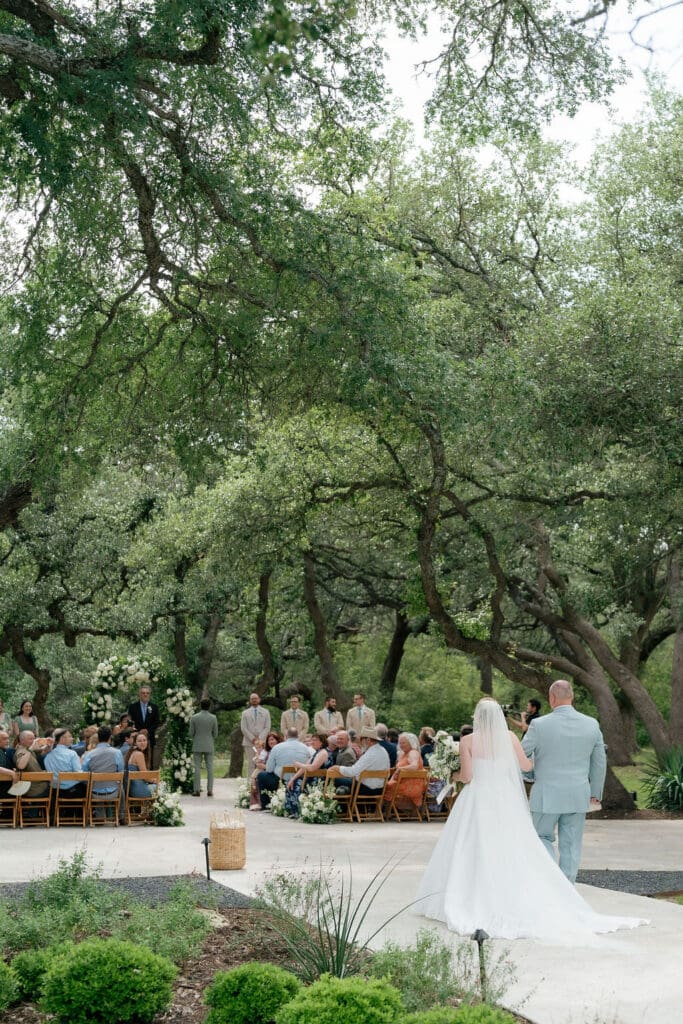 Dana walking down the aisle at her Addison Grove wedding ceremony