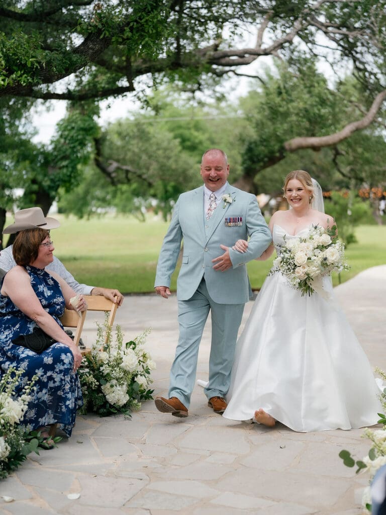 Dana walking down the aisle at her Addison Grove wedding ceremony