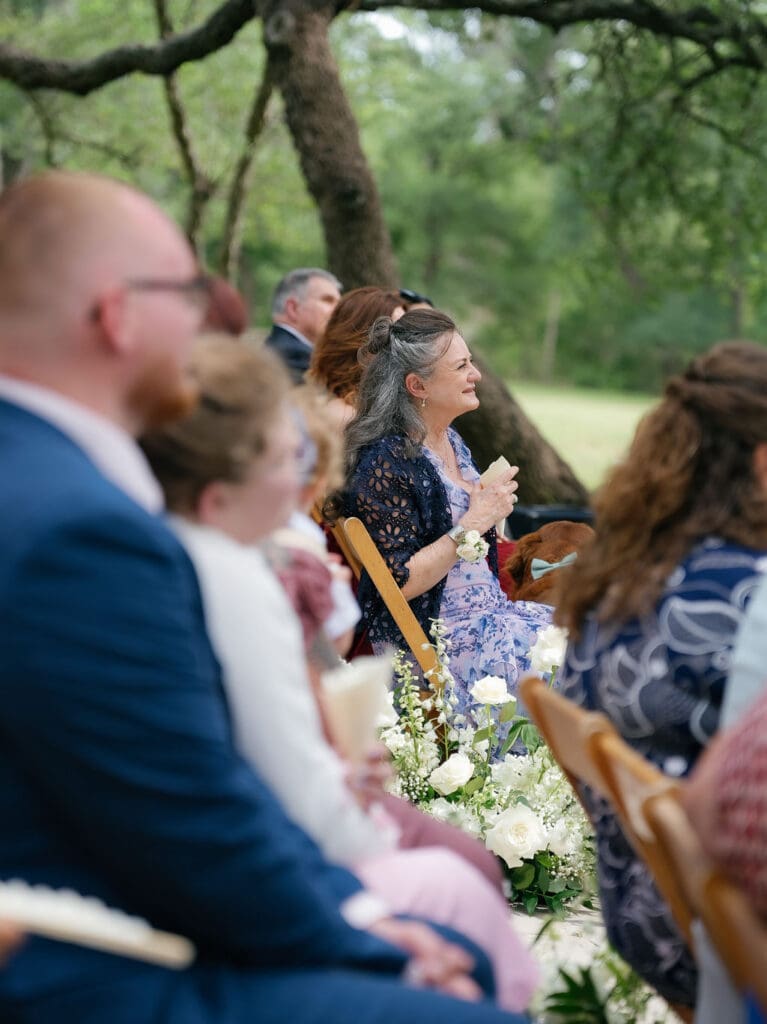 Wedding guests watching the ceremony at a Texas Hill Country venue