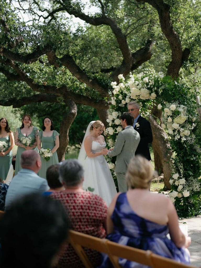 Dana and Jack exchanging vows in front of family and friends
