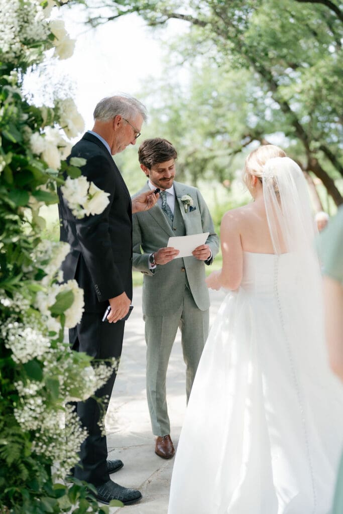Dana and Jack exchanging vows in front of family and friends