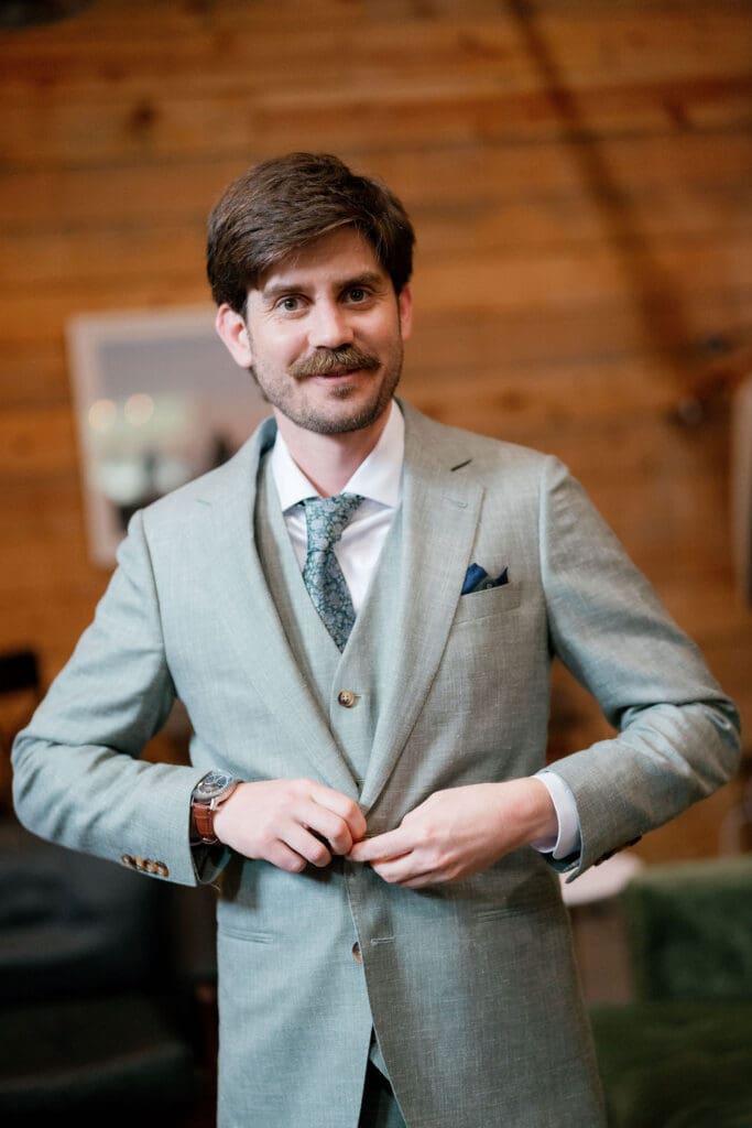 Groom Jack fully dressed in his suit, ready for his Addison Grove wedding