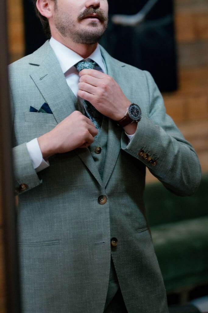 Groom Jack fully dressed in his suit, ready for his Addison Grove wedding