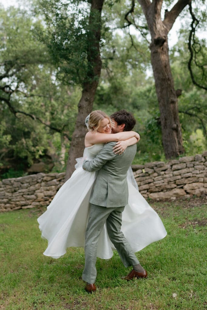 Bride and groom laughing together during golden hour wedding portraits