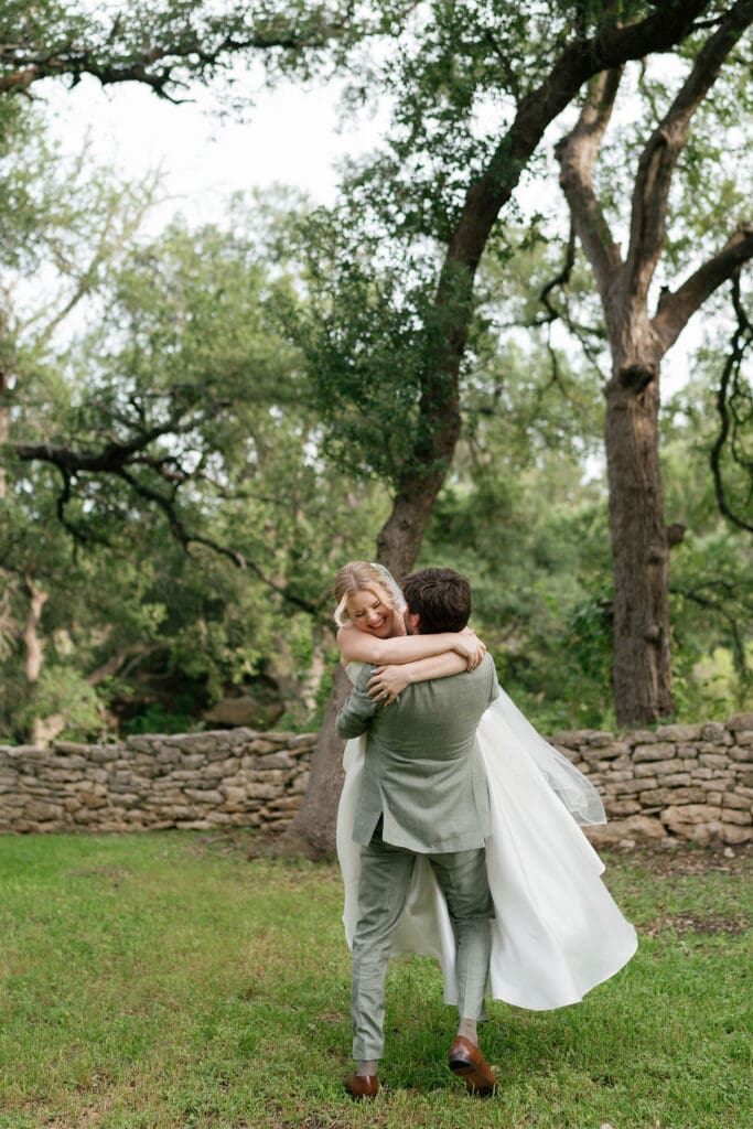 Bride and groom laughing together during golden hour wedding portraits