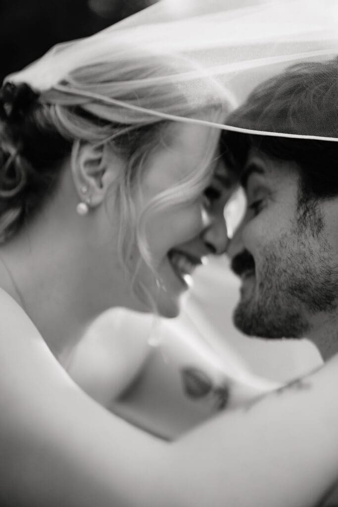 Bride and groom sharing a happy moment at their Addison Grove wedding in Texas