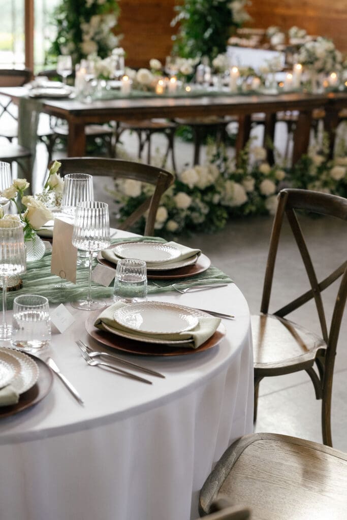 Place settings and candles on a beautifully styled reception table
