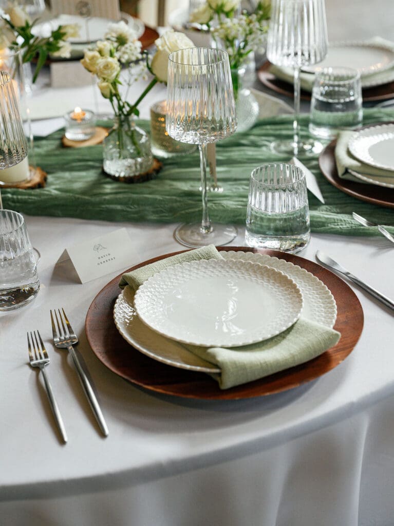 Elegant reception table settings with soft, romantic decor