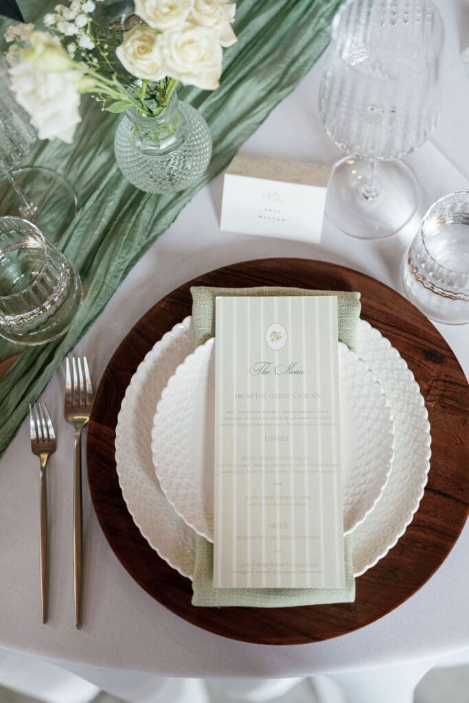 Elegant reception table settings with soft, romantic decor
