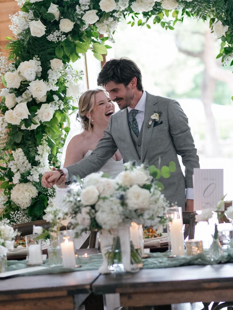 Dana and Jack entering their reception to cheers from friends and family