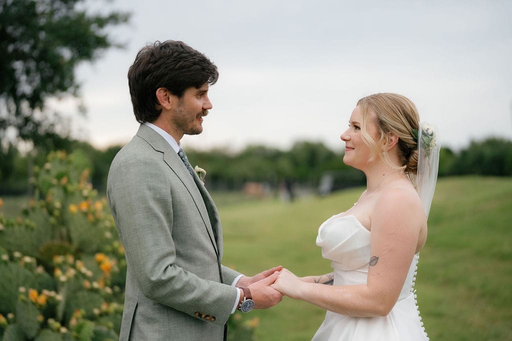 Dana and Jack smiling together at their summer Addison Grove wedding in Texas