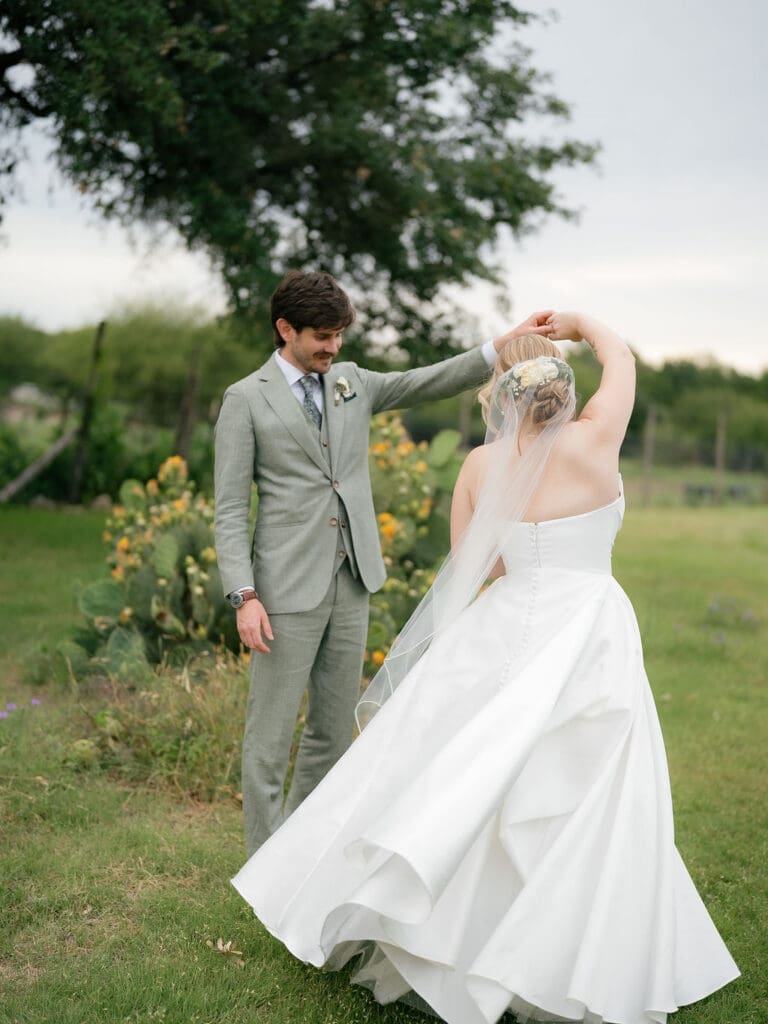 Dana and Jack smiling together at their summer Addison Grove wedding in Texas