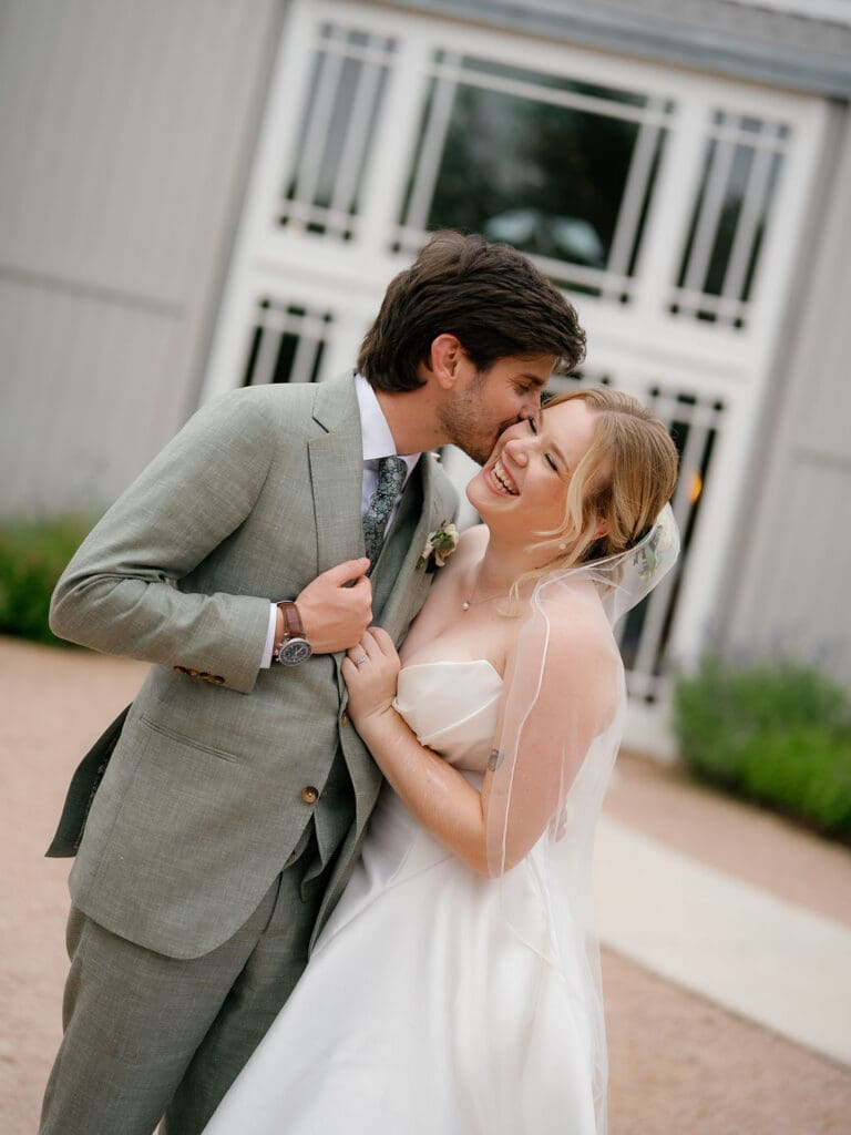 Joyful newlyweds Dana and Jack at their Addison Grove wedding venue in Austin