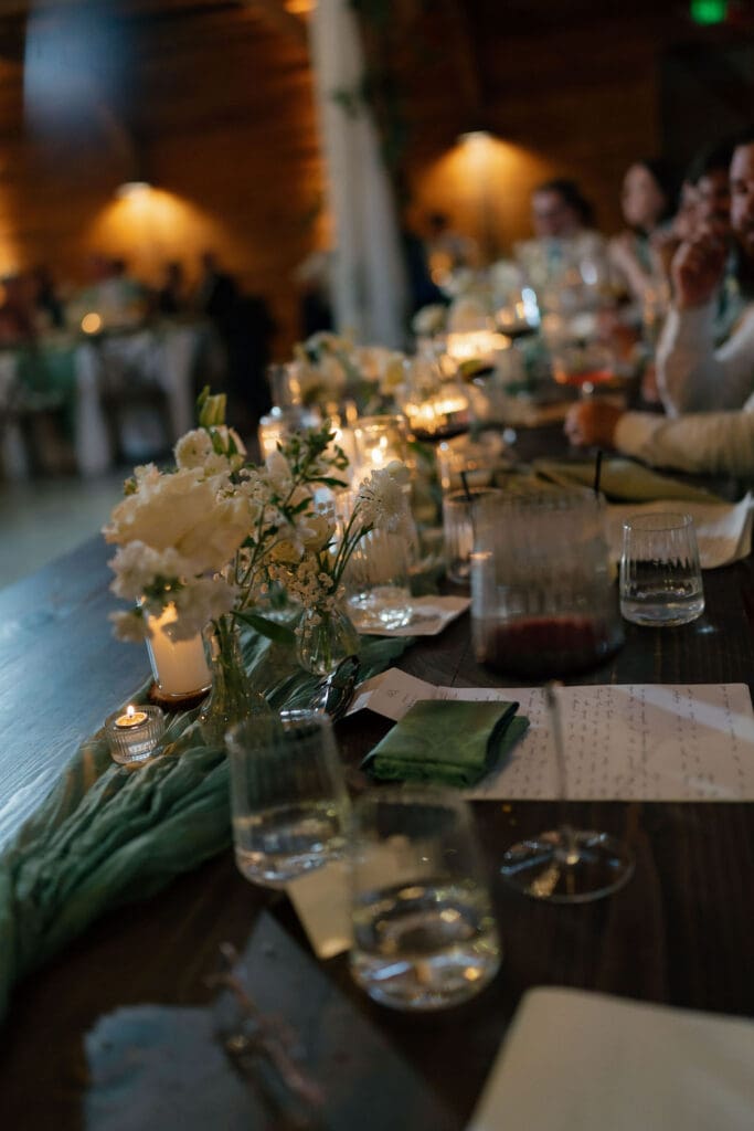 Place settings and candles on a beautifully styled reception table