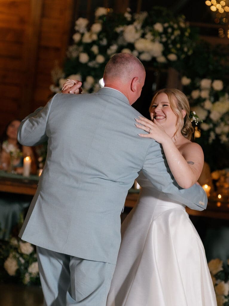 Bride and groom dancing with family at their Addison Grove reception