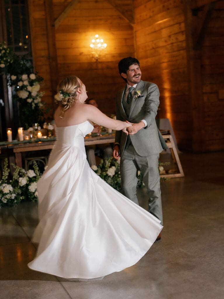 Dana and Jack sharing their first dance surrounded by loved ones