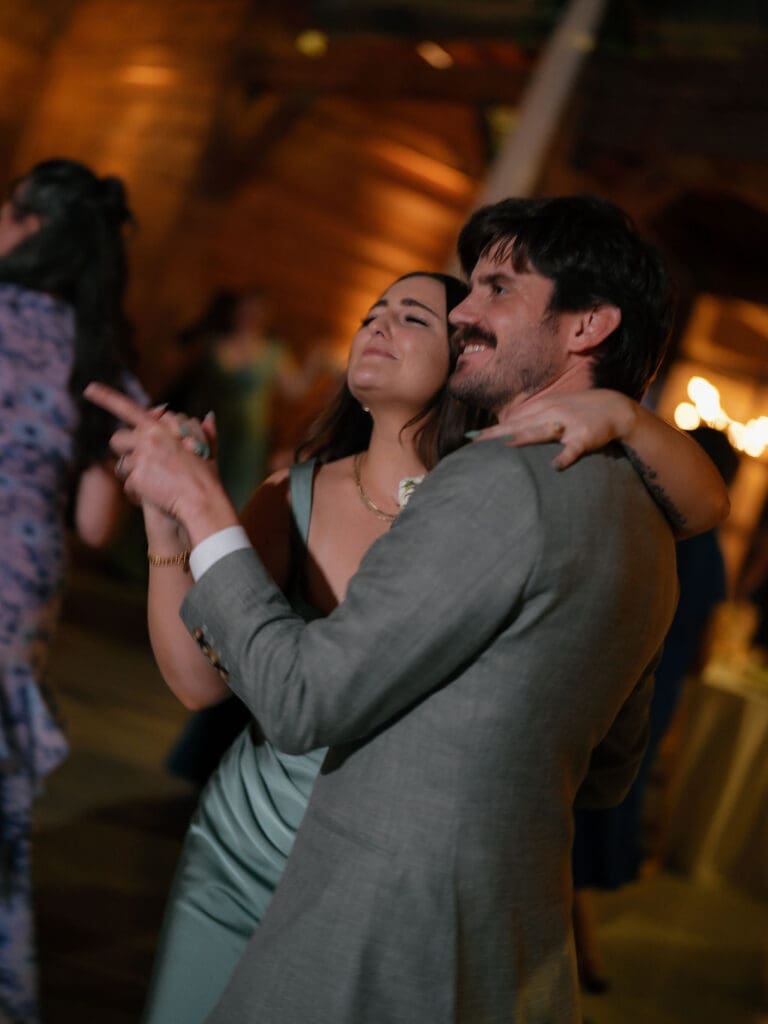 Dana and Jack dancing with guests on the wedding dance floor