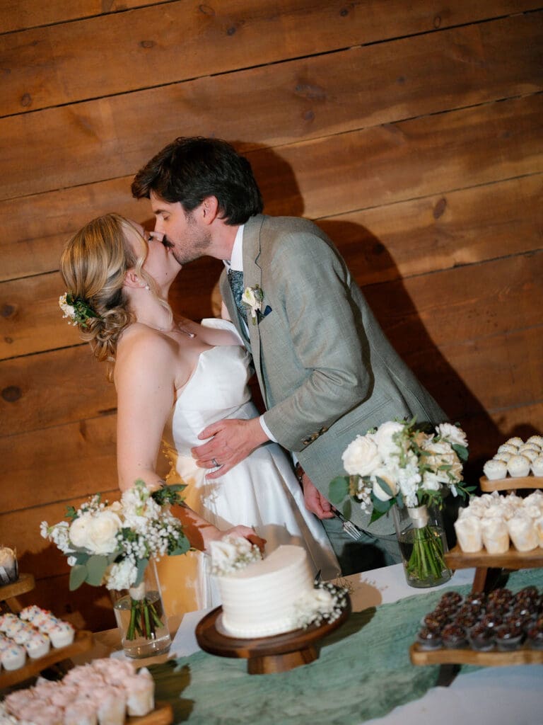 Cake cutting moment at a Texas Hill Country wedding reception