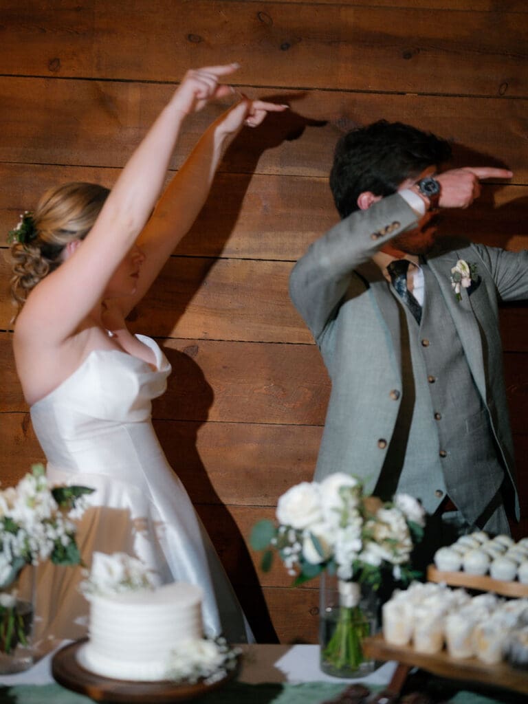 Cake cutting moment at a Texas Hill Country wedding reception