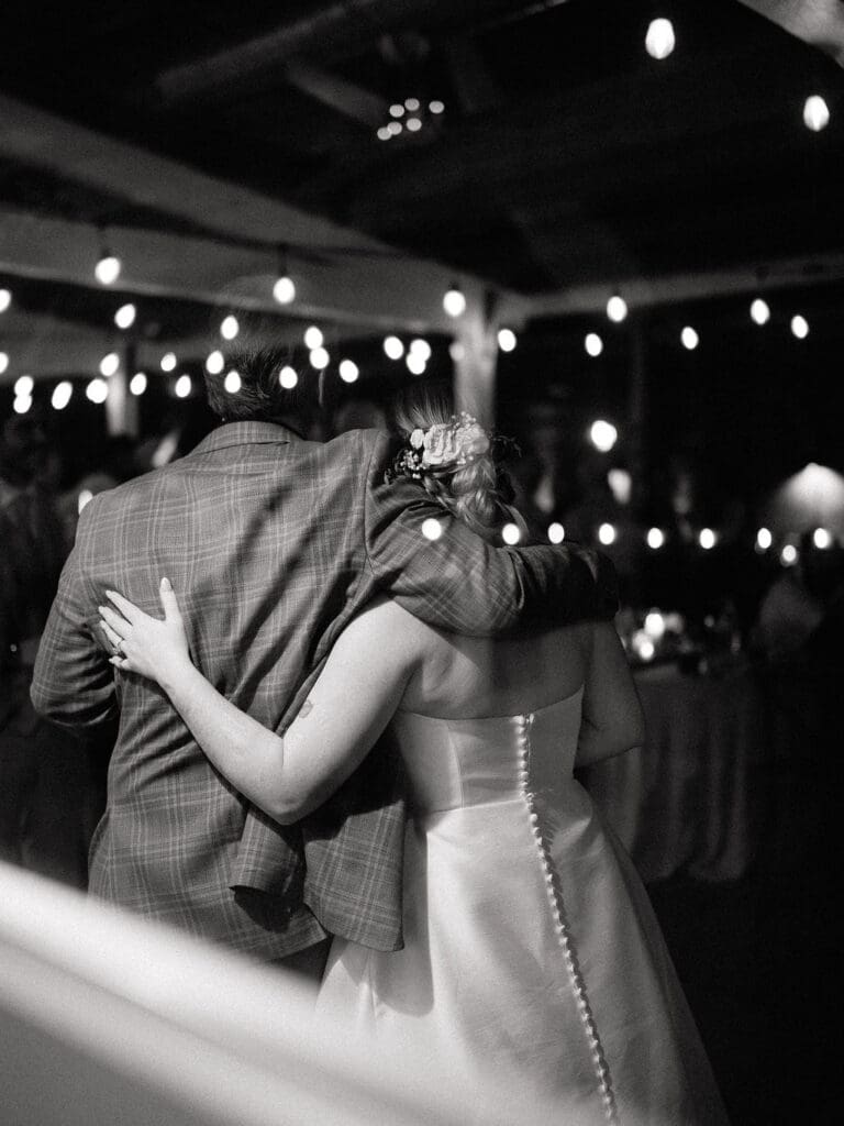 Dana and Jack dancing with guests on the wedding dance floor