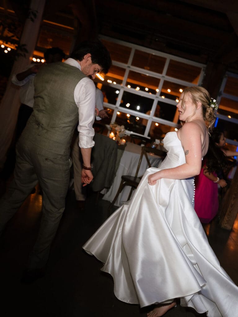 Dana and Jack dancing with guests on the wedding dance floor