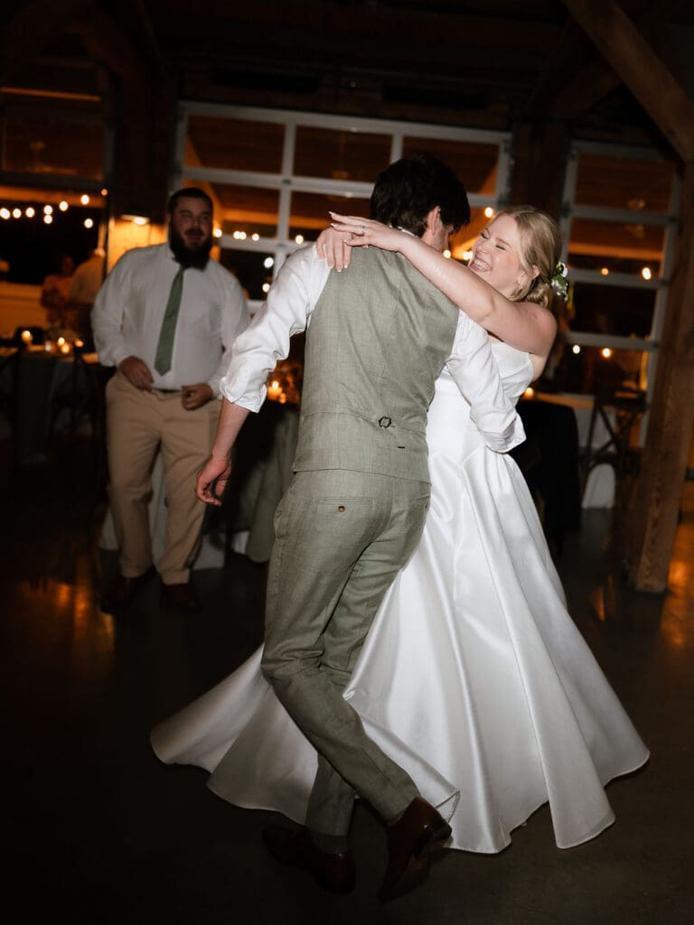 Dana and Jack dancing with guests on the wedding dance floor