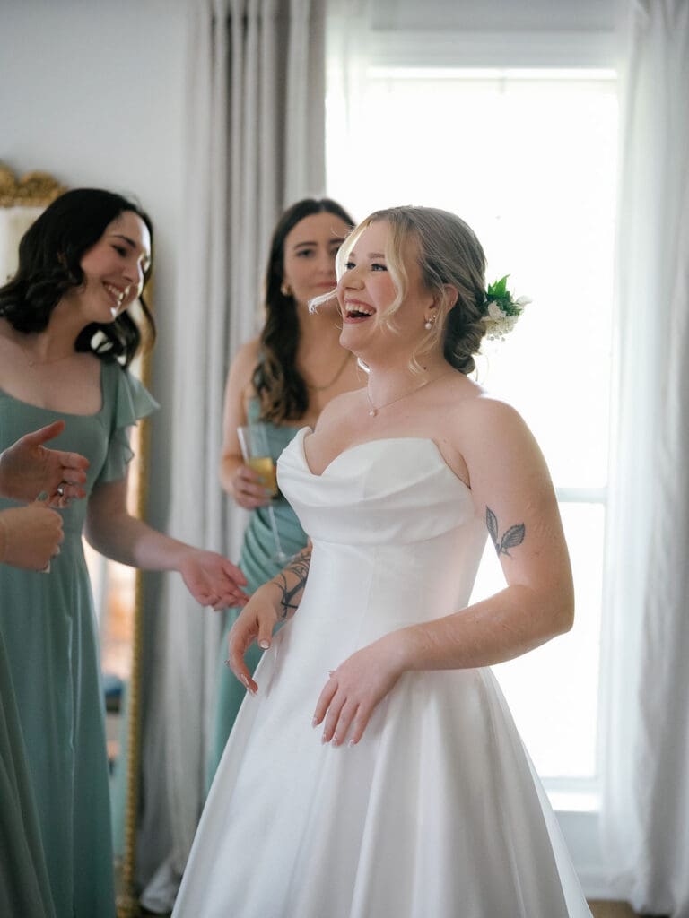 Bride Dana getting ready with her bridesmaids on her wedding morning